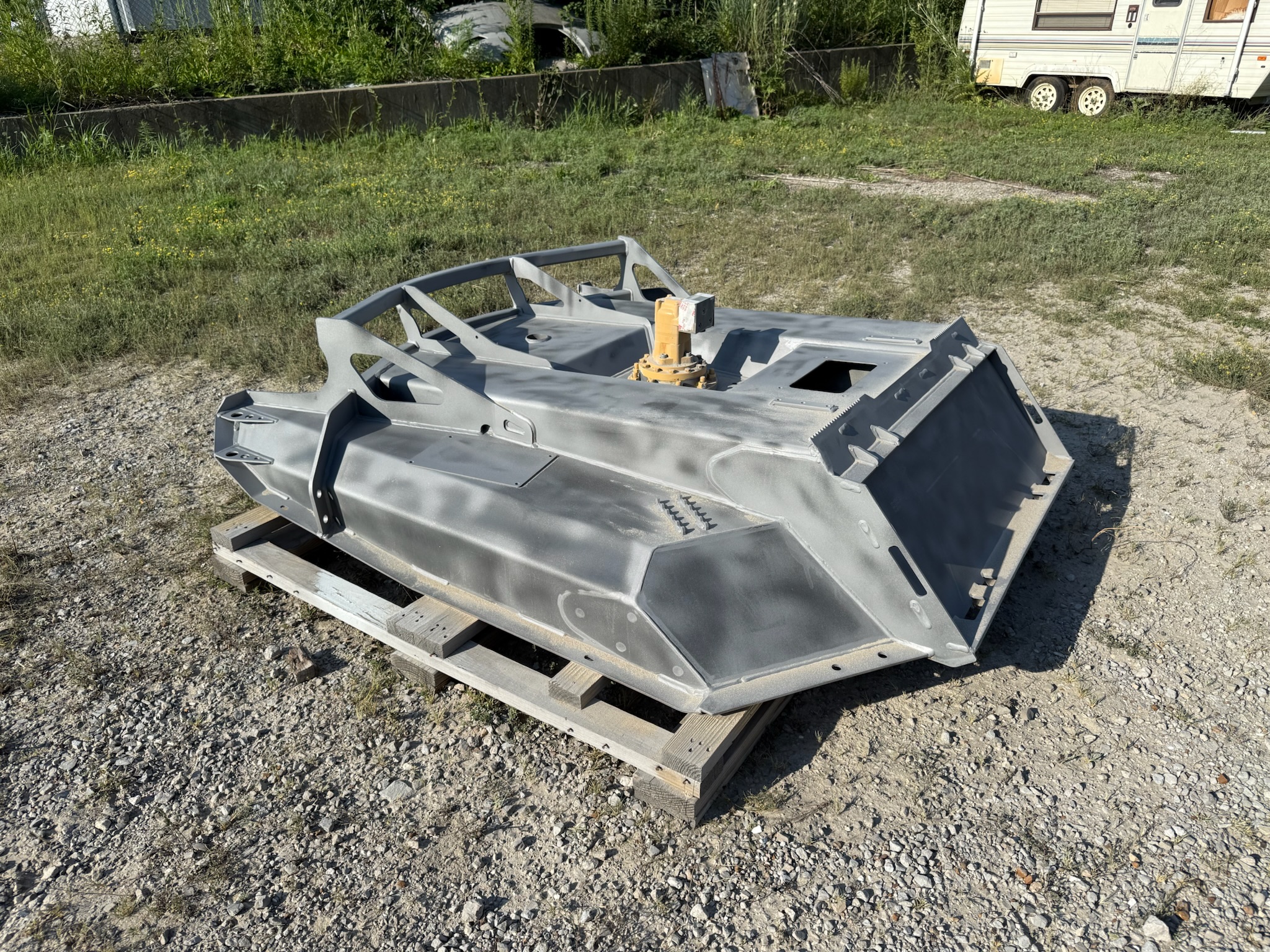Heavy equipment cab panel blasted to bare metal