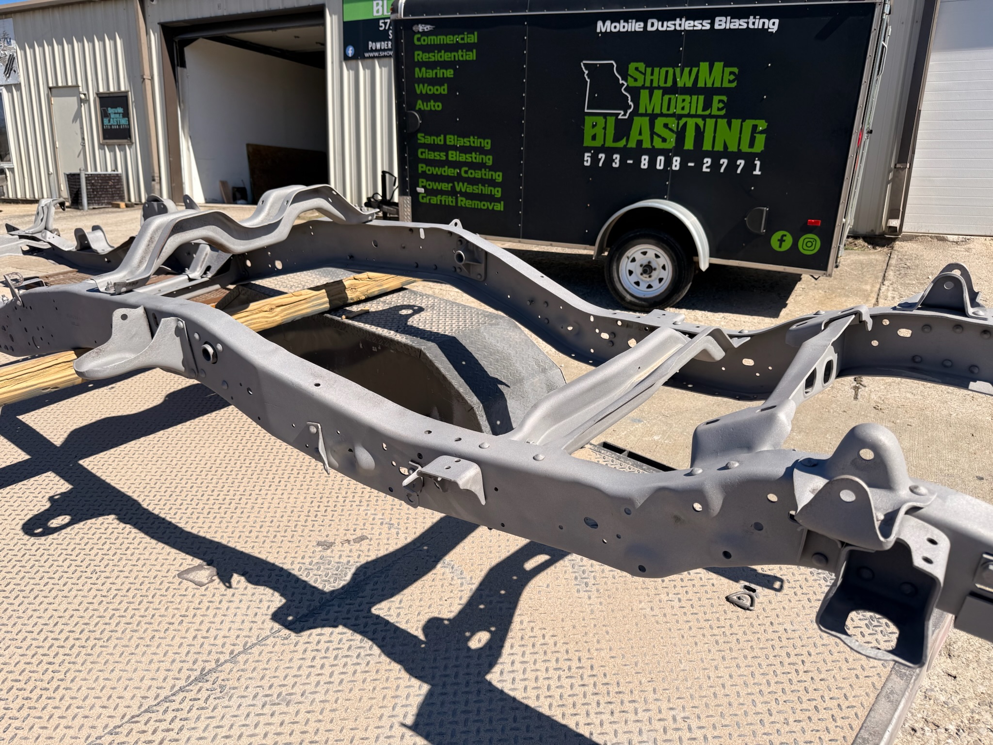 Industrial sandblasting — truck chassis blasted to bare metal with ShowMe Mobile Blasting trailer